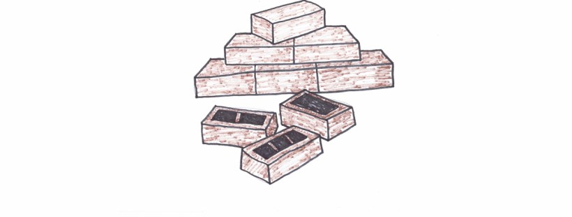 Three brown bricks are strewn on the ground. One of the bricks has a large rectangular hole in it. Another one has two smaller holes, while the third brick has three smaller holes in it. Beyond the pile of bricks is the beginning of a brick wall. These bricks do not have holes in them. The bottom row has three bricks lined up evenly. Two bricks stand atop the first row, a single brick atop the second row. The final brick is off kilter, a work in progress.